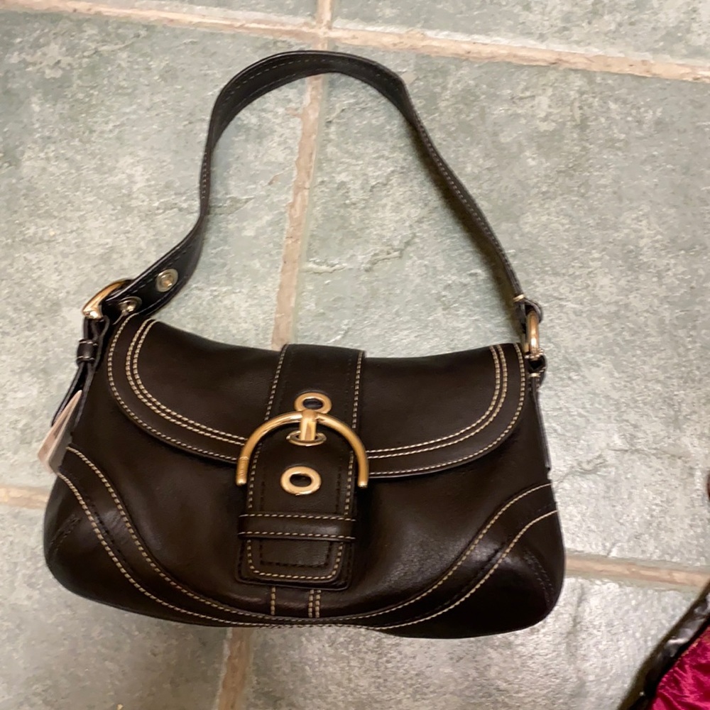 Medium Coach everyday black leather purse.
